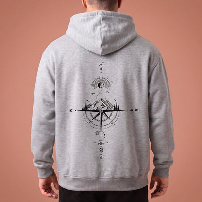 Solane Compass Hoodie in grey marl, oversized pullover with black compass and mountain line drawing across the back panel, worn by model