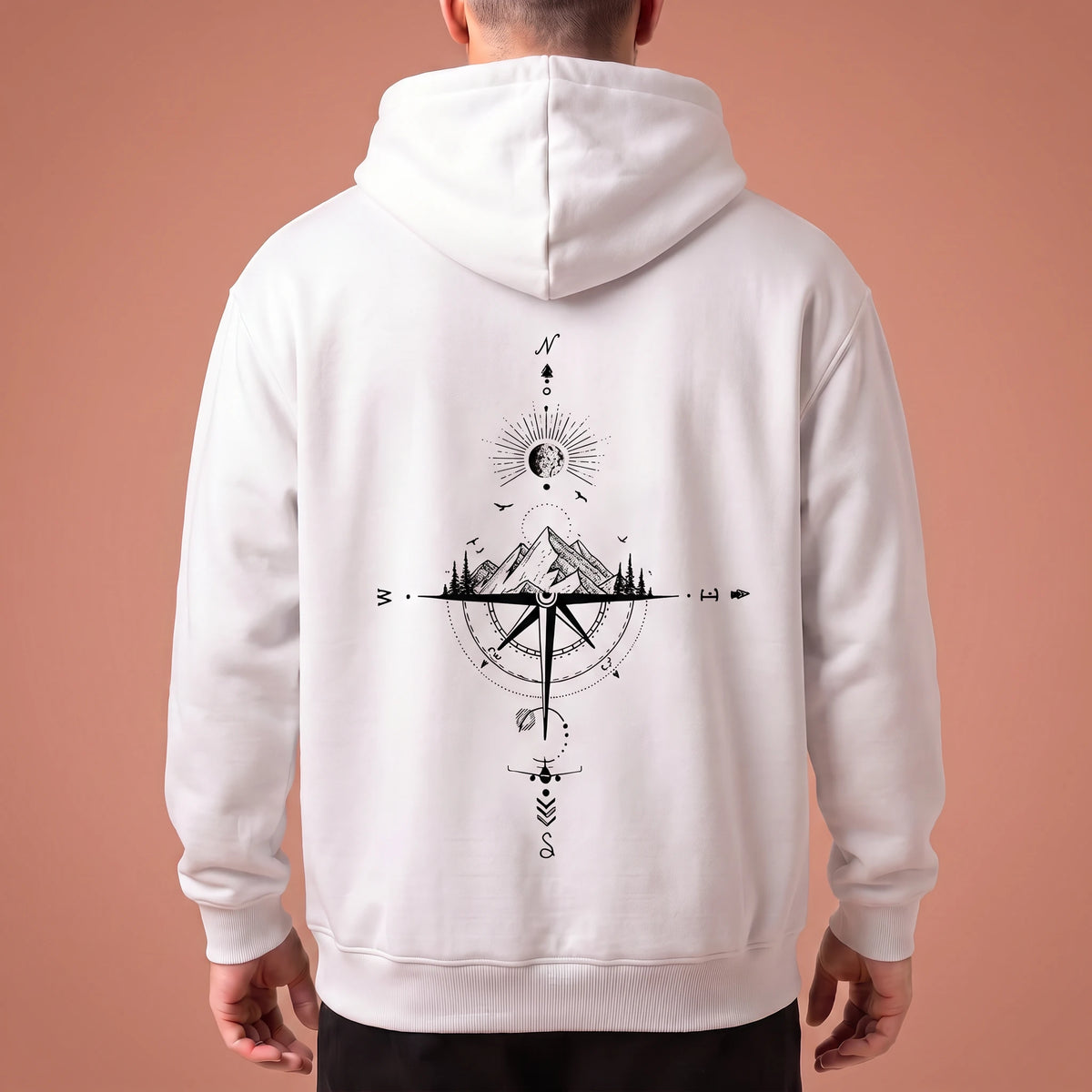 Solane Compass Hoodie in white, oversized pullover with black compass and mountain line drawing across the back panel, worn by model