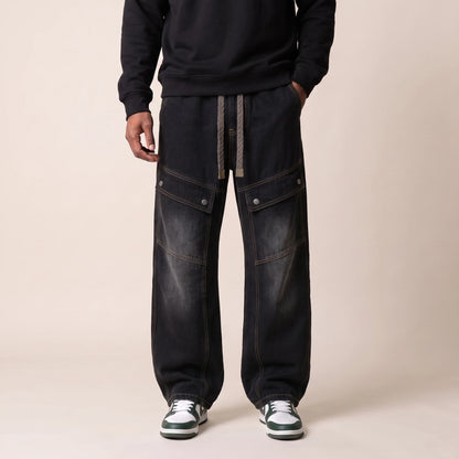 Sorrel Drawcord Jean in black, men's wide-leg cargo jeans with a drawcord waist and snap-flap thigh pockets, front view