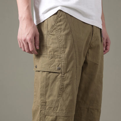 Tate Field Cargo Pant in khaki, men's loose straight-leg cargo pants with flap pockets, close-up of the snap-flap cargo pocket and panel seams