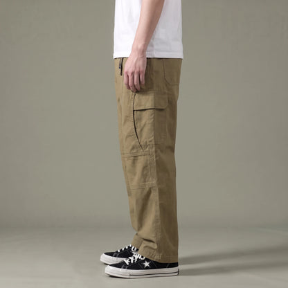 Tate Field Cargo Pant in khaki, men's loose straight-leg cargo pants with flap pockets, side view showing the flap cargo pocket