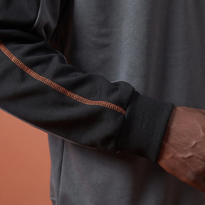 Tavish Stitch Crewneck gray, close-up of orange sleeve stitch and ribbed cuff