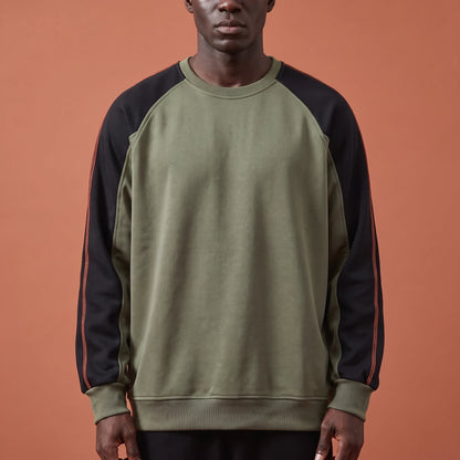 Tavish Stitch Crewneck in green, men's olive raglan crewneck sweatshirt with black contrast sleeves and orange stitch line