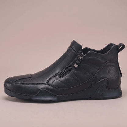 Thorne Stitched Boot in black, men's slip-on ankle boot with side zip and stitched panels, side view