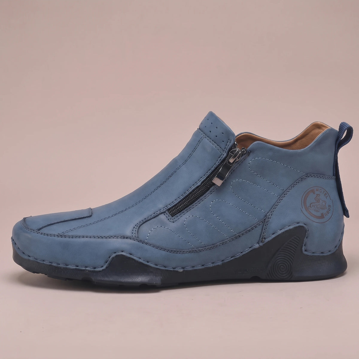 Thorne Stitched Boot in blue, men's slip-on ankle boot with side zip and stitched panels, side view