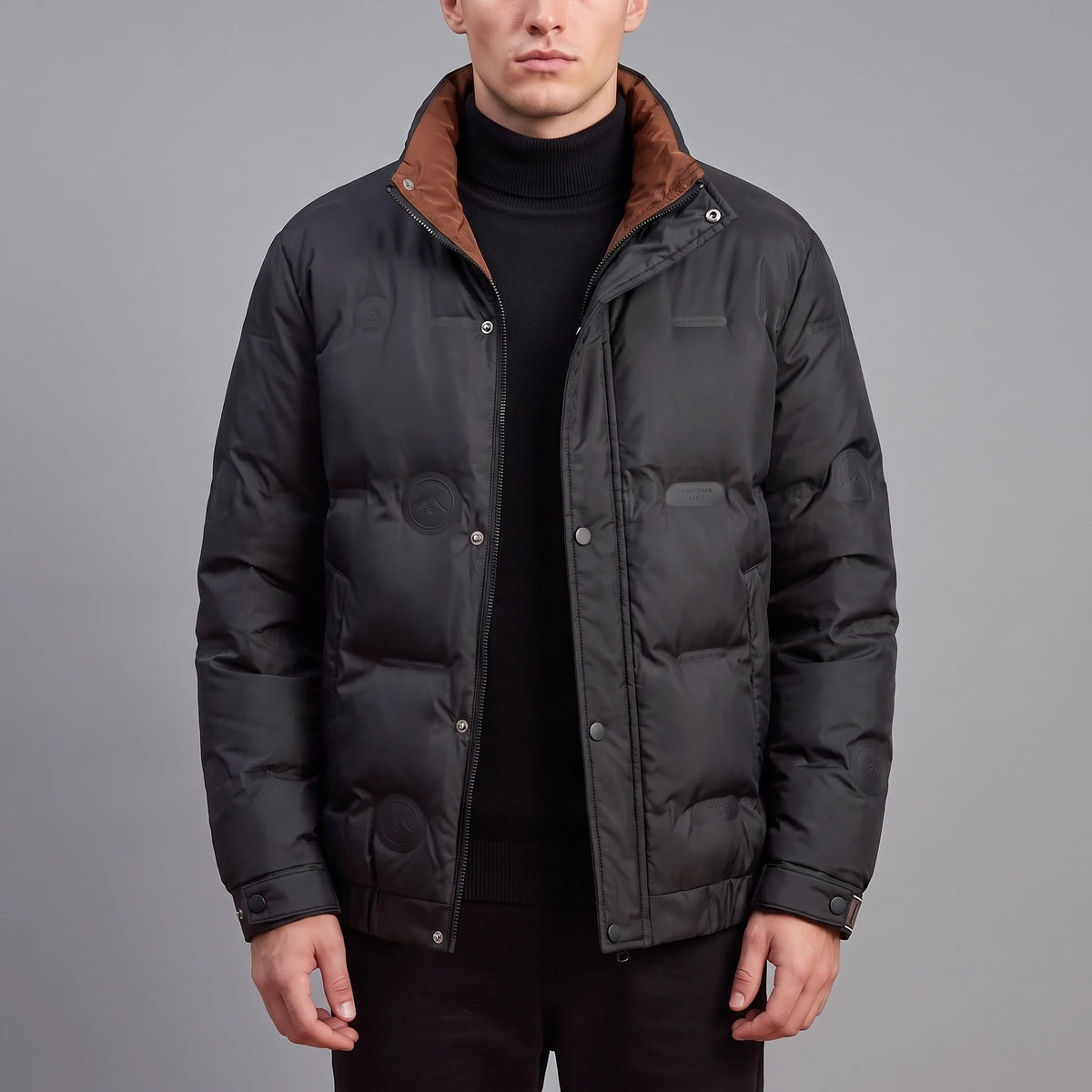 Torvald Down Jacket in black, men's goose down puffer with stand collar and rust-brown collar lining, worn front view