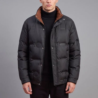 Torvald Down Jacket in black, men's goose down puffer with stand collar and rust-brown collar lining, worn front view