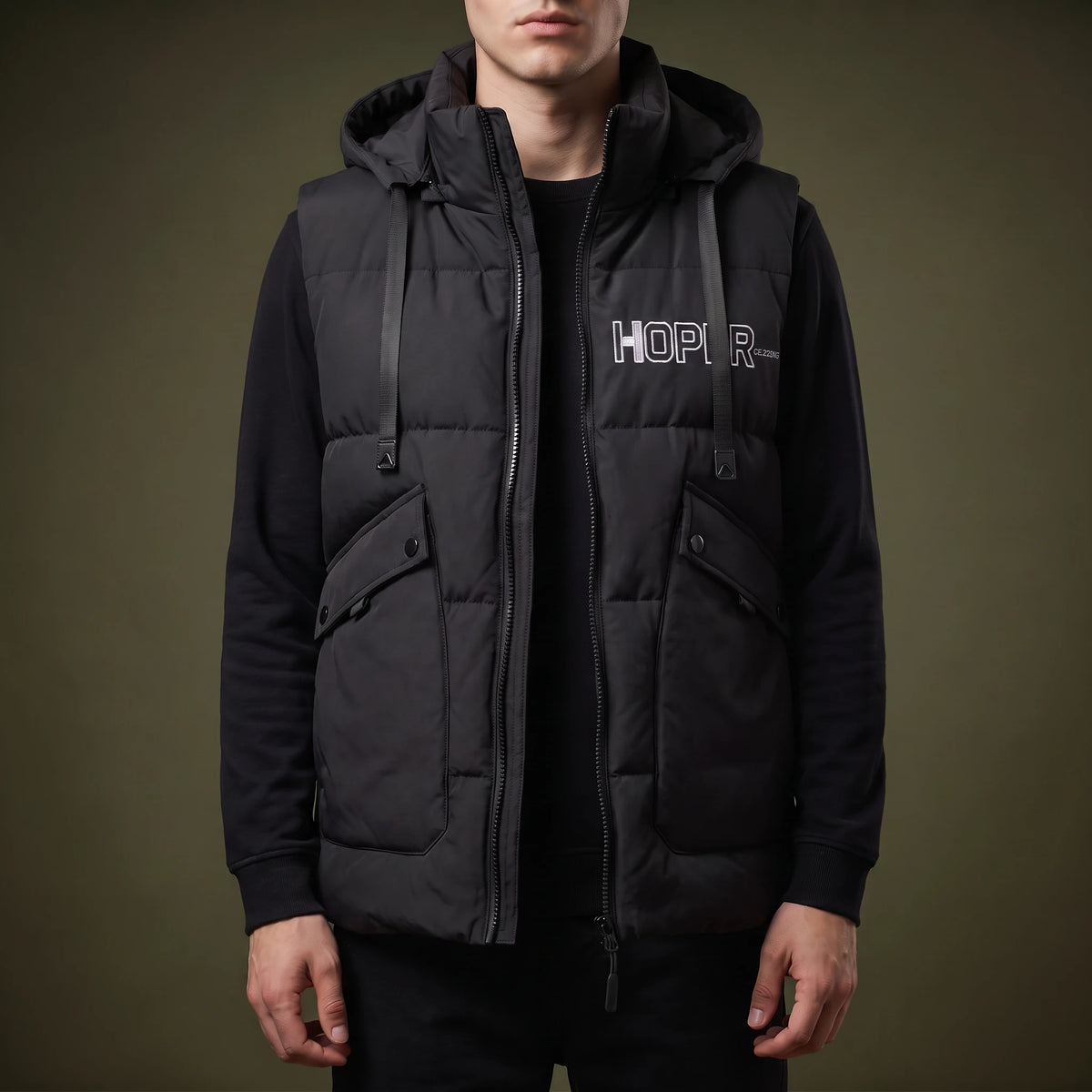Norvell Hooded Gilet in Black, quilted padded hooded vest with full front zip, flap pockets and webbing straps