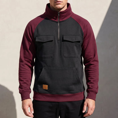 Calvano Half-Zip Sweatshirt in Black - black funnel-neck pullover with burgundy raglan sleeves worn by a model