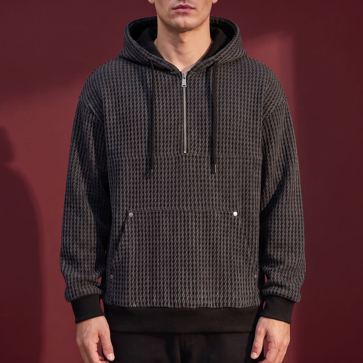Kaevik Waffle Hoodie in Charcoal - chunky waffle knit quarter-zip hoodie worn by a model