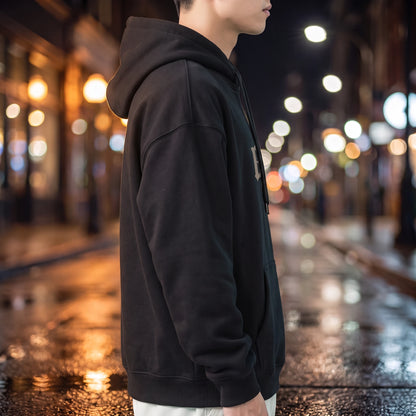 Vallor Gothic Hoodie in black, side profile showing the plain sleeve, hood down and ribbed cuff