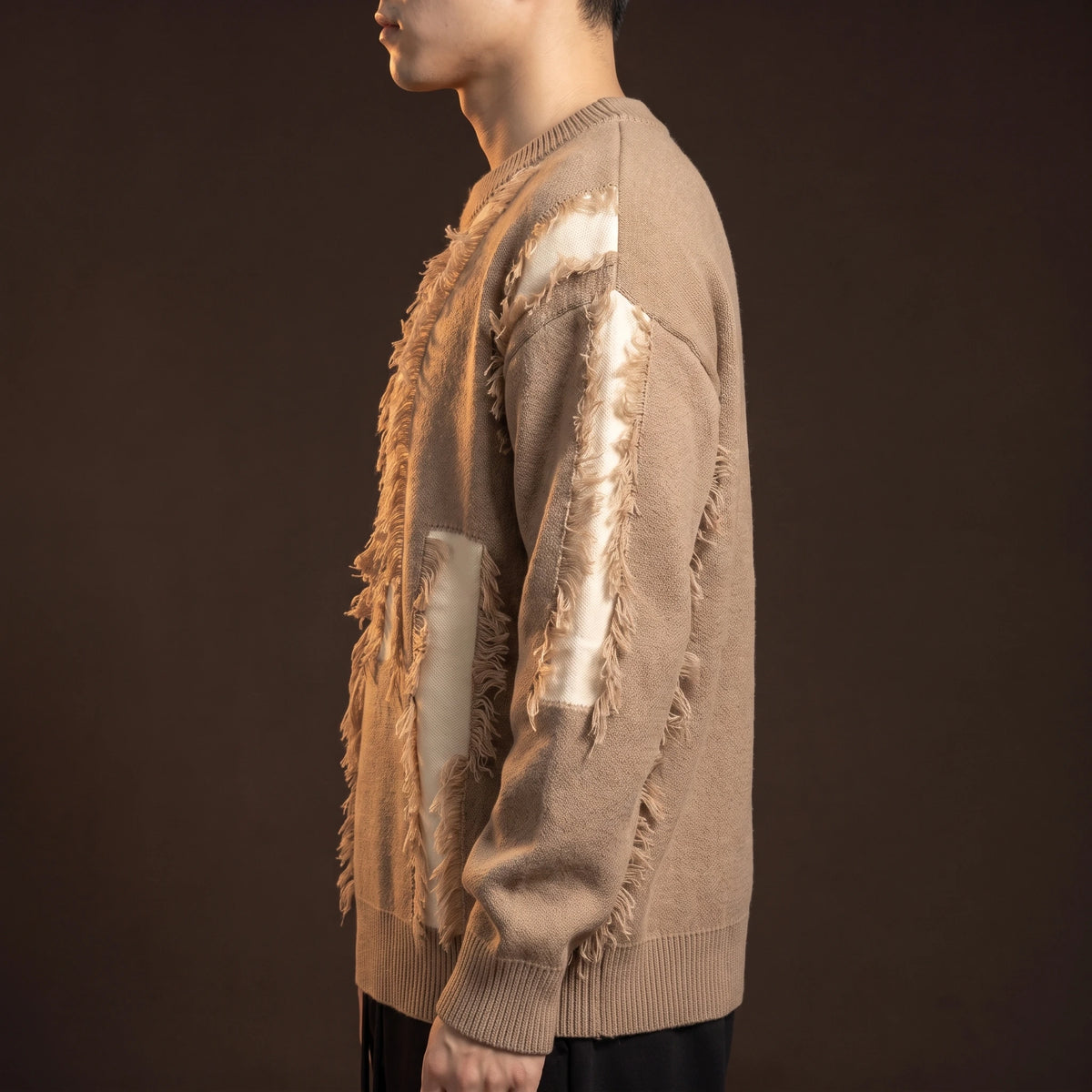 Verrick Distressed Sweater side view showing the oversized drop-shoulder fit and frayed sleeve band