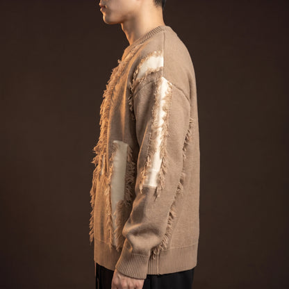 Verrick Distressed Sweater side view showing the oversized drop-shoulder fit and frayed sleeve band