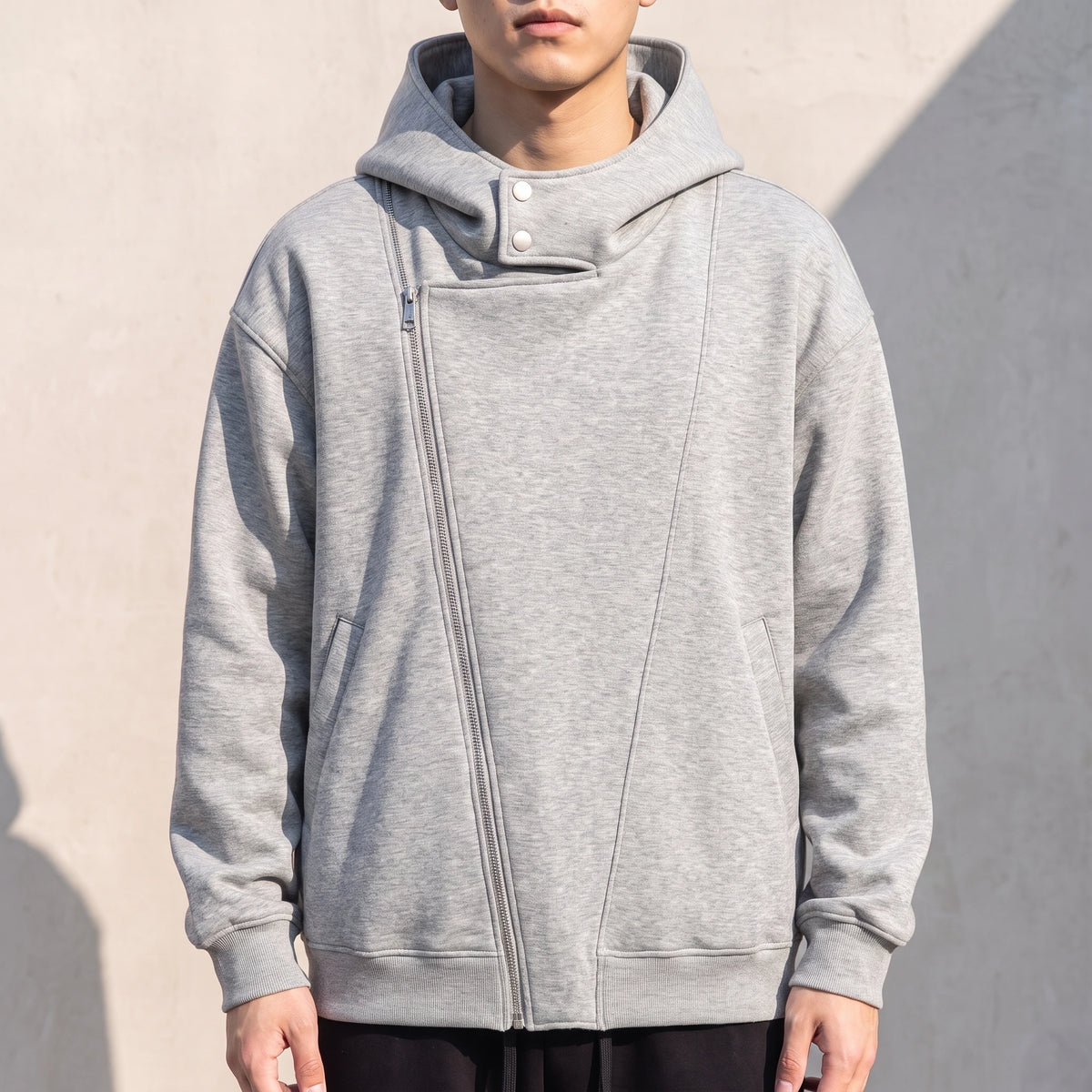 Solteri Collared Hoodie in Grey, oversized bonded fleece hooded jacket with asymmetric diagonal zip and snap storm collar, worn front view