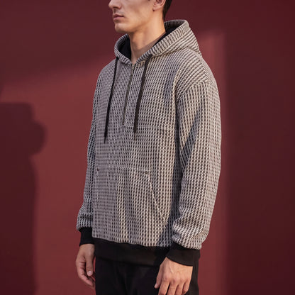 Kaevik Waffle Hoodie in Grey - side view showing kangaroo pouch pocket and black ribbed hem