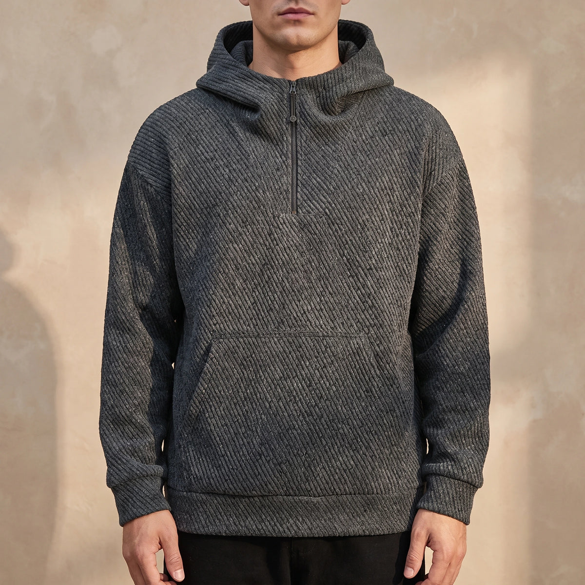 Ostrel Textured Hoodie in Charcoal, oversized diagonal-rib knit hoodie with quarter zip, worn front view